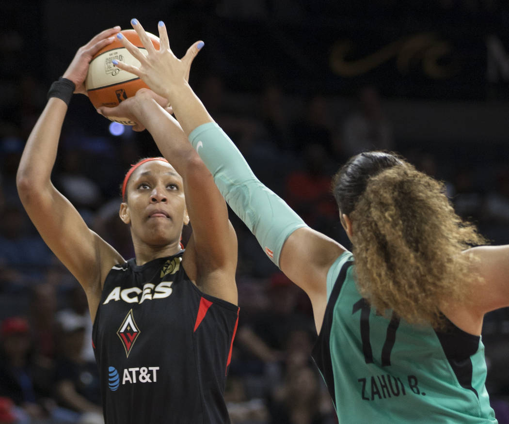 Las Vegas Aces center A'ja Wilson (22) shoots a corner jump shot over New York Liberty center A ...