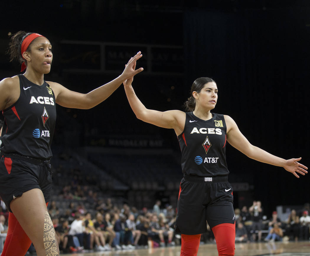 Las Vegas Aces guard Kelsey Plum (10) celebrates with Las Vegas Aces center A'ja Wilson (22) in ...