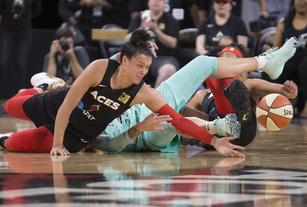 Las Vegas Aces guard Kayla McBride (21) reaches for a loose ball in the first quarter during Ve ...