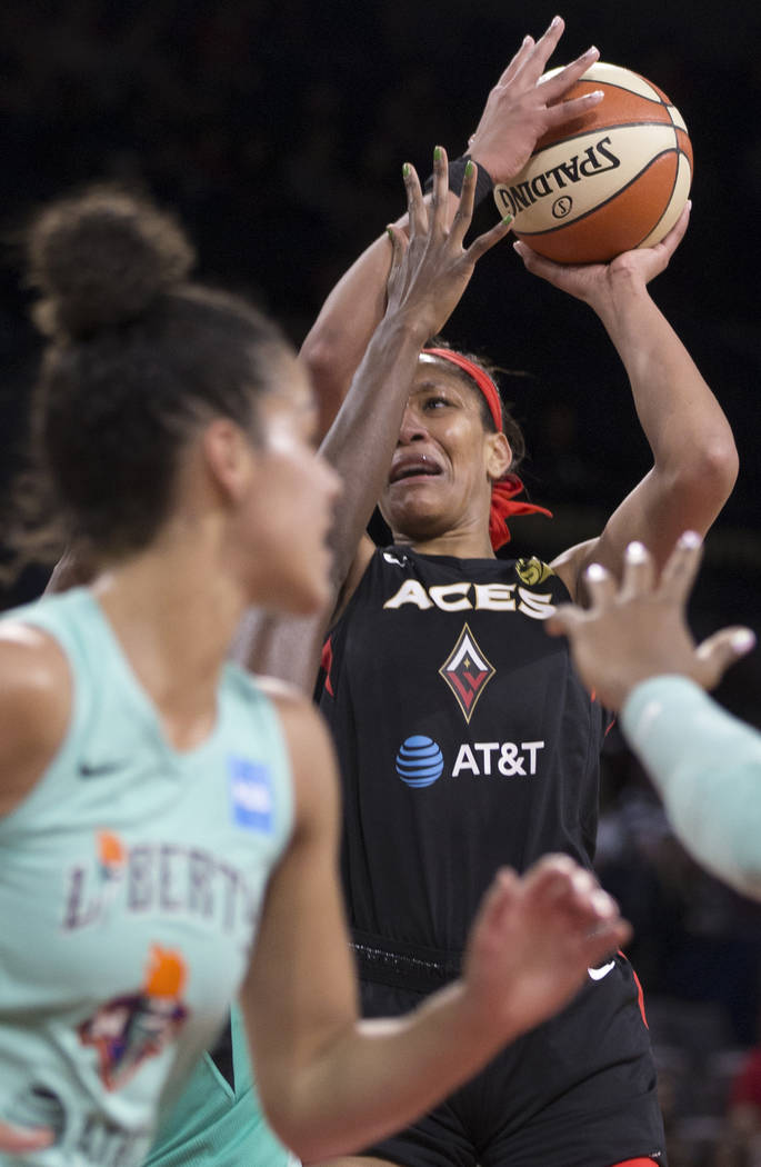 Las Vegas Aces center A'ja Wilson (22) slashes to the rim in traffic in the first quarter durin ...