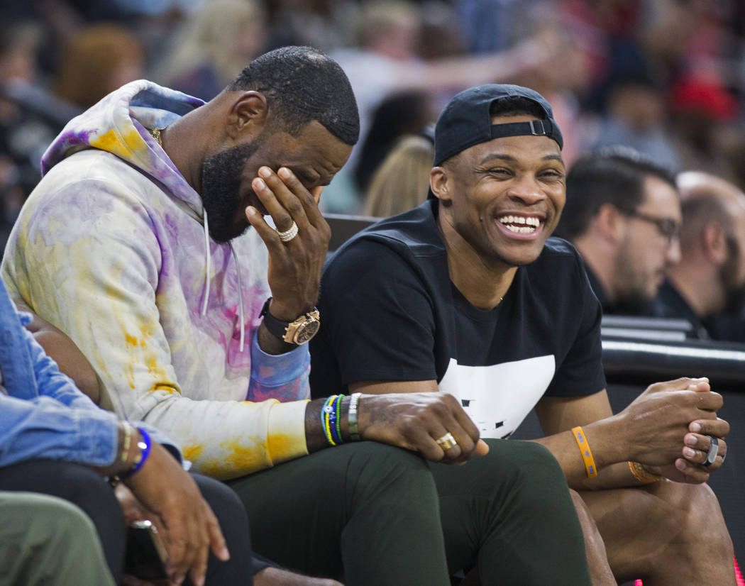 Oklahoma City Thunder point guard Russell Westbrook, right, shares a laugh with Los Angeles Lak ...