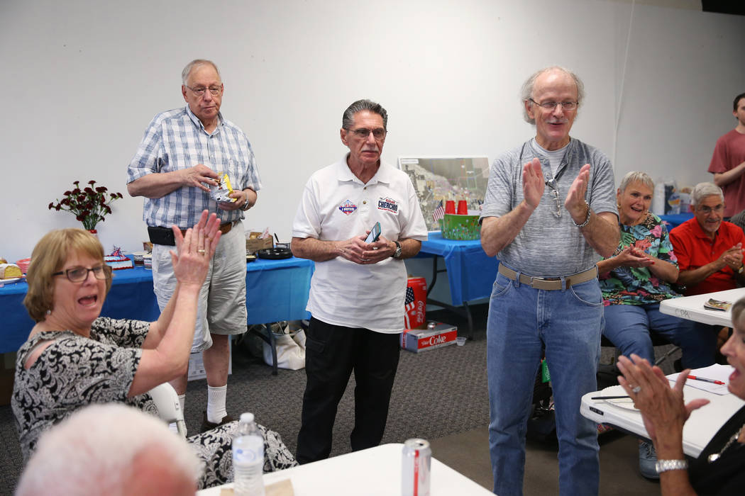 North Las Vegas Ward 4 incumbent councilman Richard Cherchio, center, celebrates early election ...