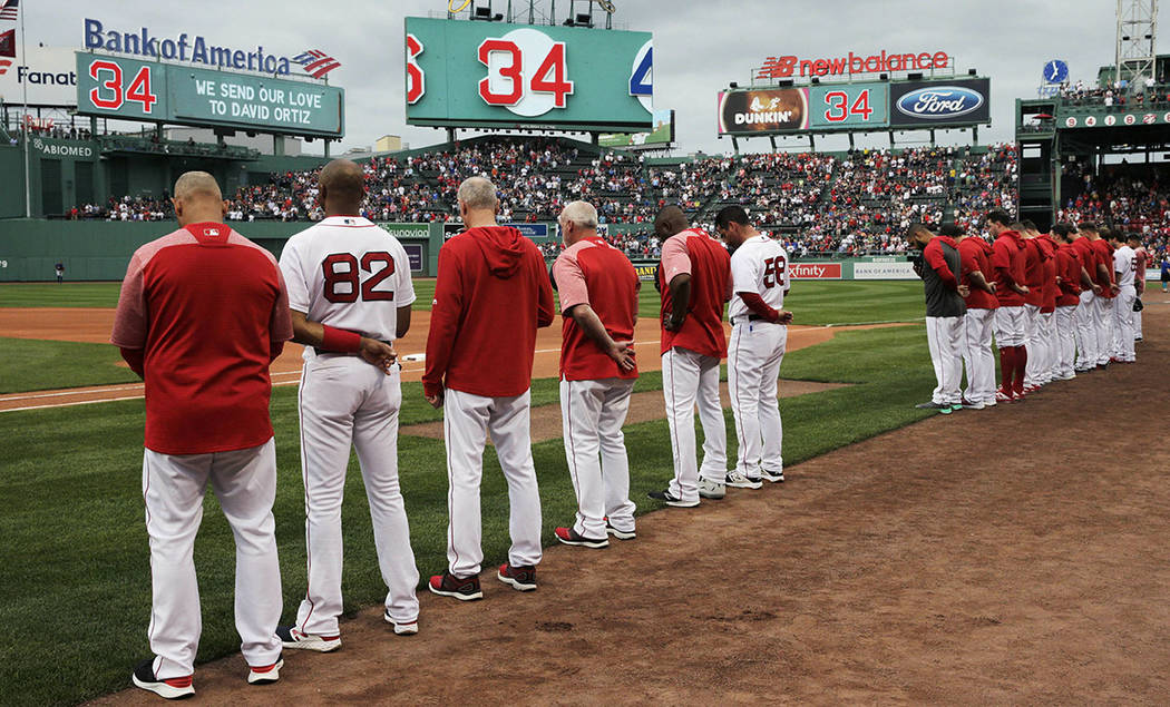 The Boston Red Sox and fans pause for a moment for former Red Sox designated hitter David Ortiz ...