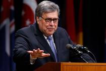 Attorney General William Barr, gestures as he speaks during a graduation ceremony for students ...