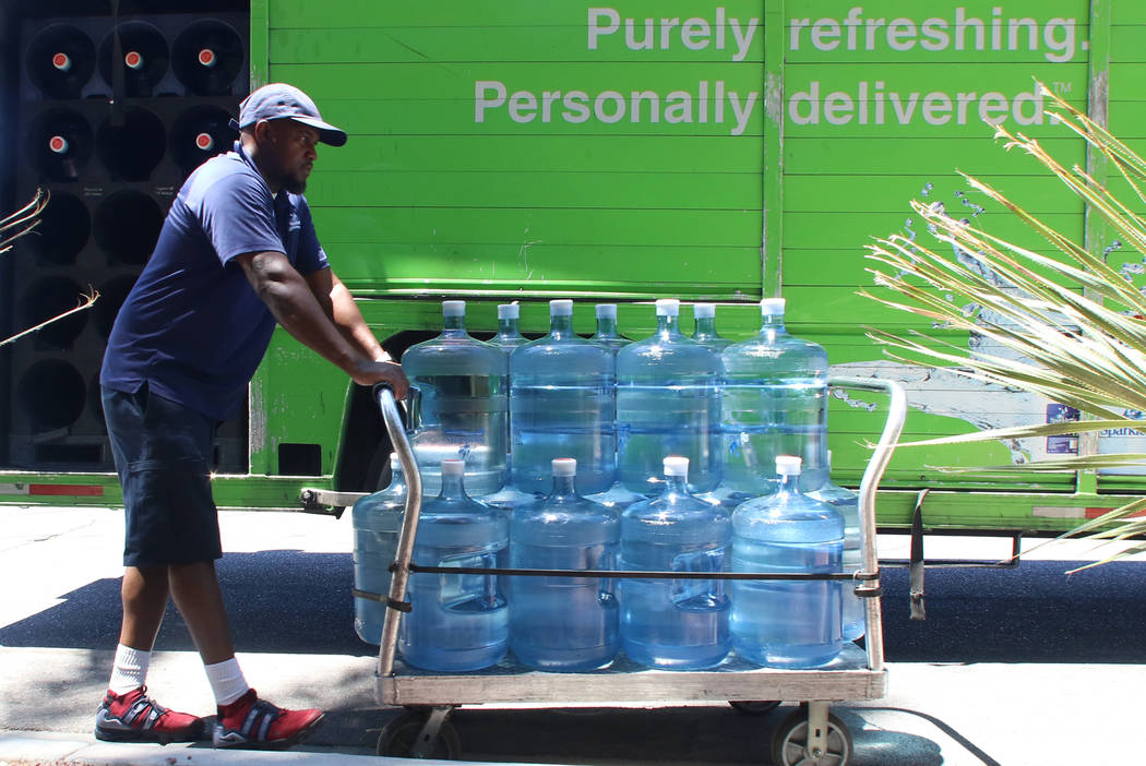 Sparkletts Water employee Ronnie Charles delivers Sparkletts water to Green Valley Ranch Resort ...