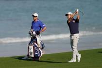 Kevin Na hits from the fairway on the 10th hole during a practice round for the U.S. Open Champ ...