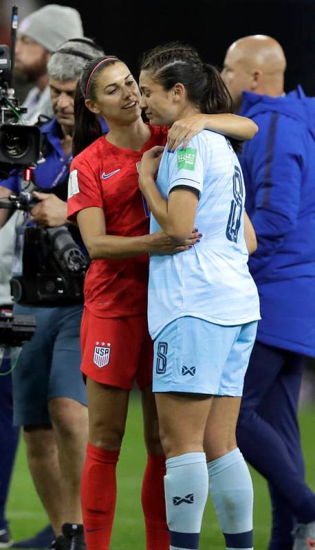 United States' Alex Morgan, left, comforts Thailand's Miranda Nild, right, after the Women's Wo ...