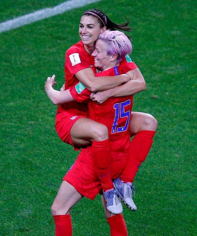 United States' Megan Rapinoe, right, congratulates teammate Alex Morgan after scoring her fifth ...