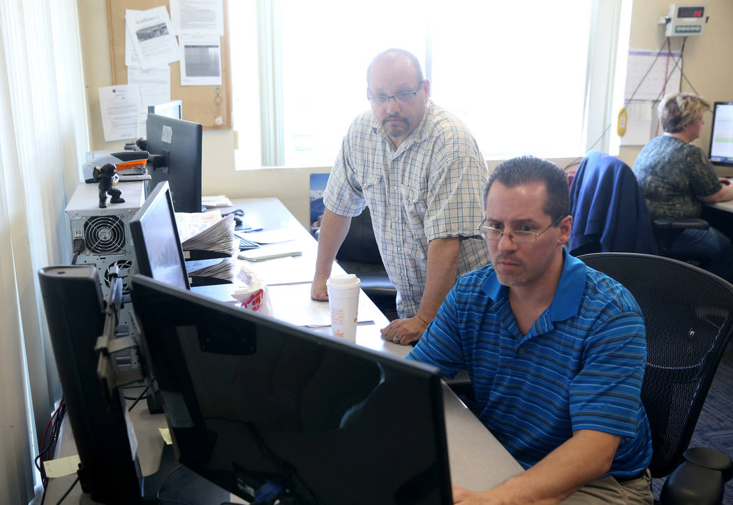 Truline Corporation employees Jason Rodriguez, driver manager, left, and Jason, Denz, fleet man ...