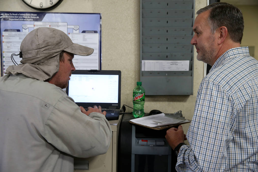 Paul Truman, owner of Truline Corporation, right, talks to lead trailer mechanic Chris Bianchi ...