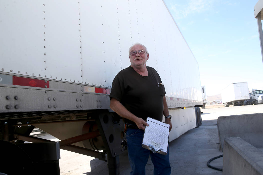 Tony Serpe, a driver trainer with Truline Corporation, prepares his rig at his trucking company ...