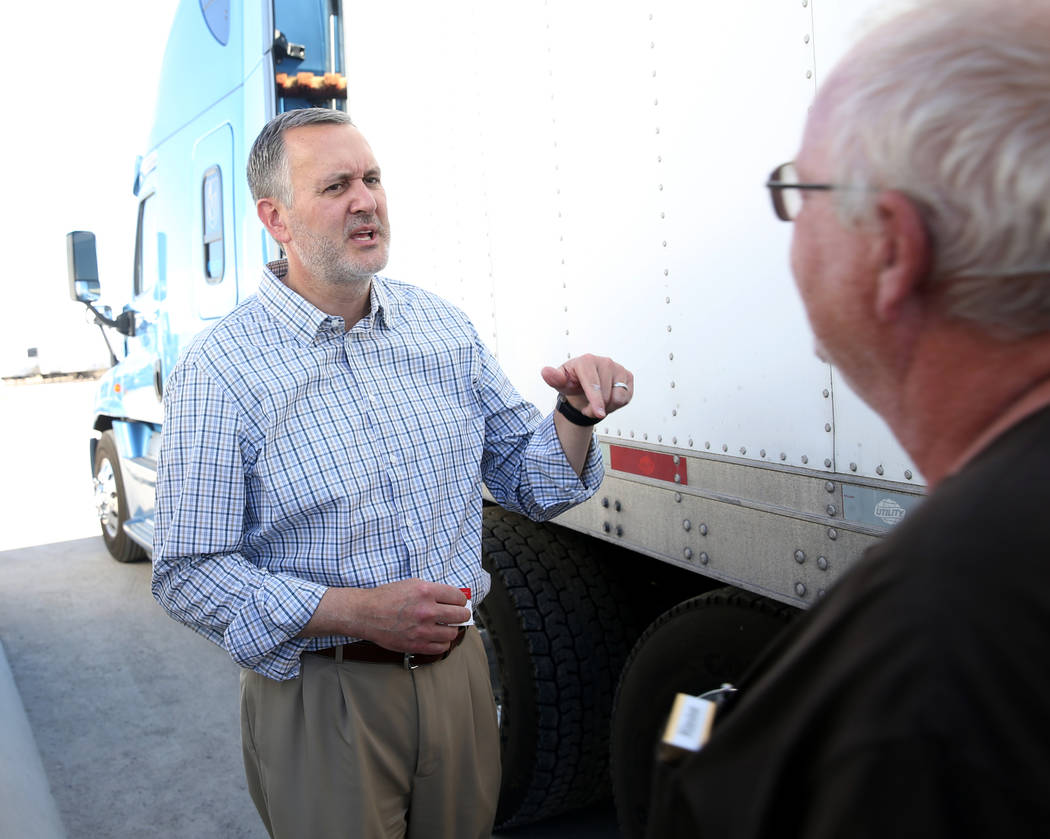 Paul Truman, owner of Truline Corporation, left, talks to driver trainer Tony Serpe at his truc ...