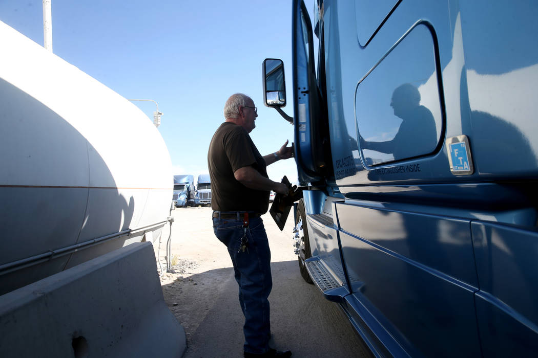 Tony Serpe, a driver trainer with Truline Corporation, prepares to move his rig at his trucking ...