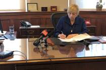Maine Democratic Gov. Janet Mills signs a bill Wednesday, June 12, 2019, in her office in Augus ...
