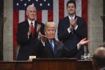 President Donald Trump gestures as delivers his first State of the Union address in the House c ...