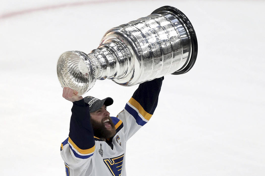 St. Louis Blues' Alex Pietrangelo carries the Stanley Cup after the Blues defeated the Boston B ...