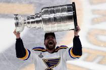 Former Vegas Golden Knights forward David Perron of the St. Louis Blues carries the Stanley Cup ...