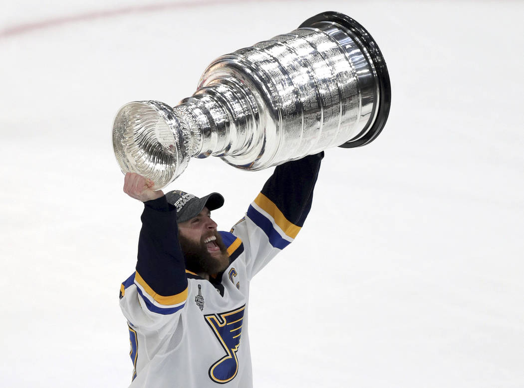 St. Louis Blues' Alex Pietrangelo carries the Stanley Cup after the Blues defeated the Boston B ...