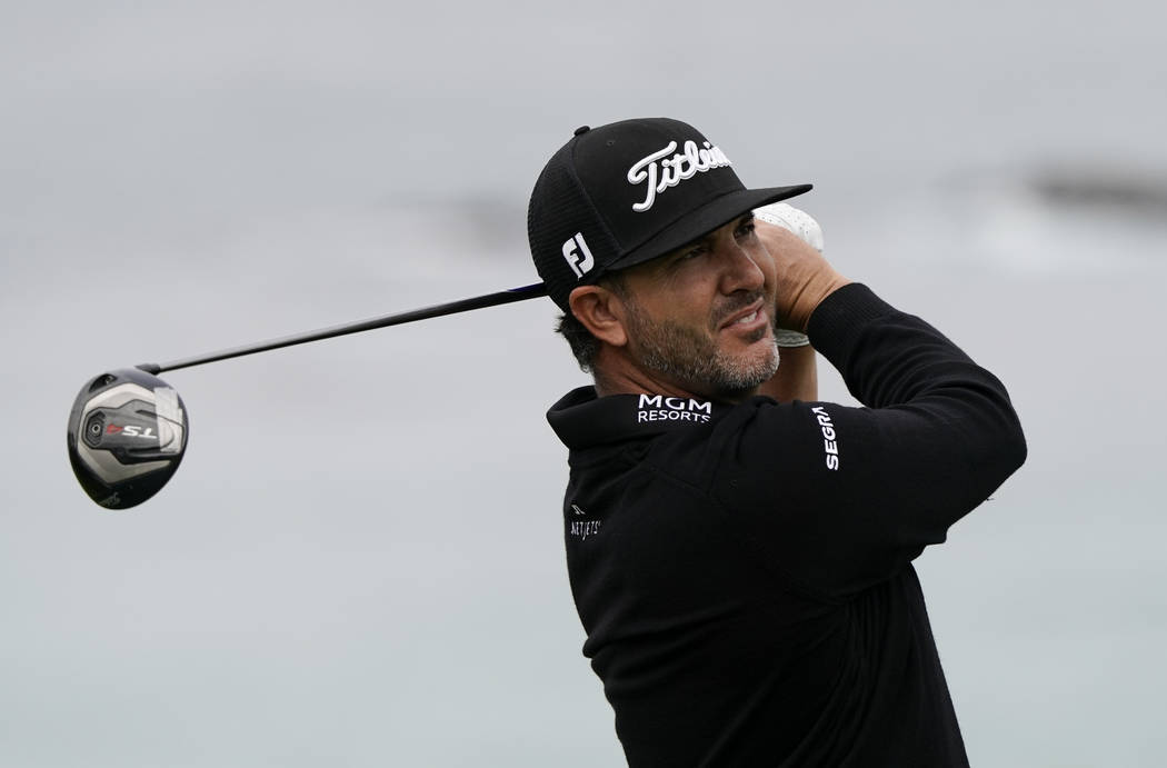 Scott Piercy watches his tee shot on the 11th hole during the first round of the U.S. Open Cham ...