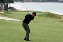 Scott Piercy hits from the fairway on the 10th hole during the first round of the U.S. Open Cha ...