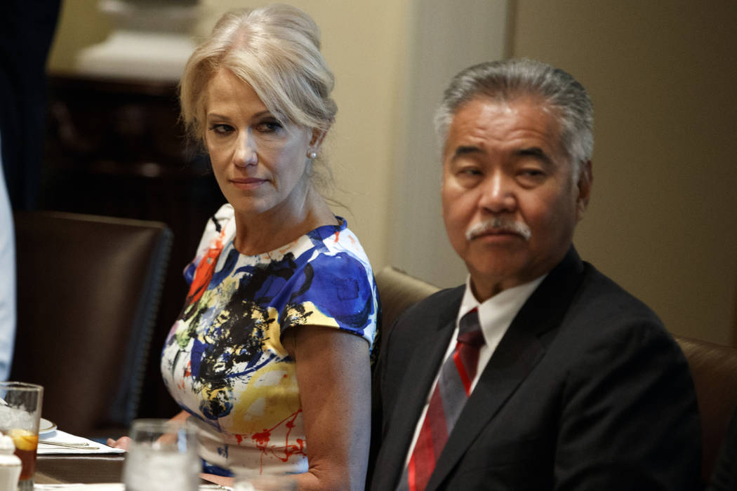 White House counselor Kellyanne Conway, left, and Hawaii Gov. David Ige listen as President Don ...