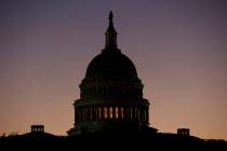 The U.S. Capitol Building Dome is seen before the sun rises in Washington, Tuesday, Dec. 18, 20 ...