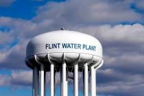FILE - In this March 21, 2016 file photo, the Flint Water Plant water tower is seen in Flint, M ...