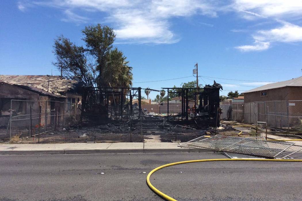 A fire that started in this house spread to two others in the 2100 block of East Stewart Avenue ...