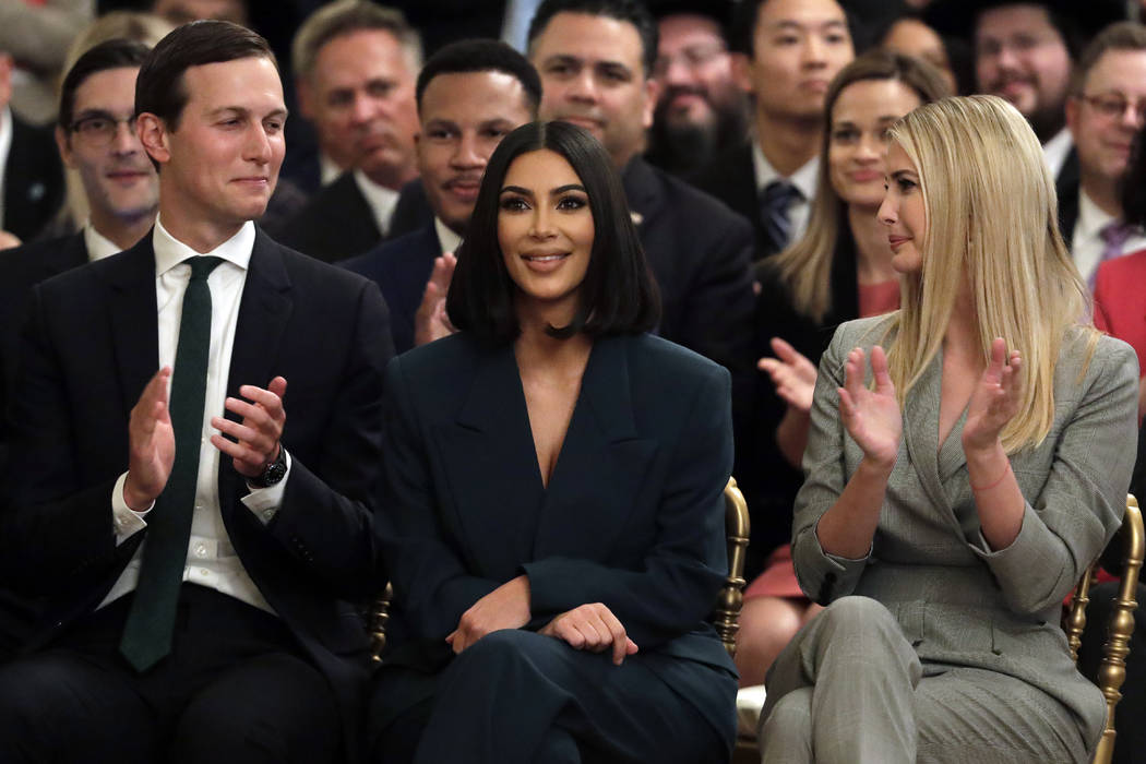 White House senior adviser Jared Kushner and Ivanka Trump, right, sit with Kim Kardashian West, ...