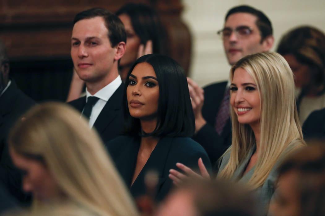 White House senior adviser Jared Kushner and Ivanka Trump, right, sit with Kim Kardashian West, ...
