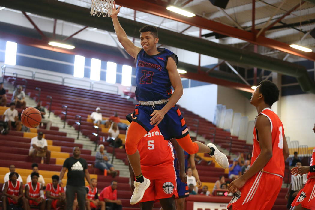 Las Vegas Knicks guard Nick Blake is fouled (23) during his basketball game at Del Sol Academy ...