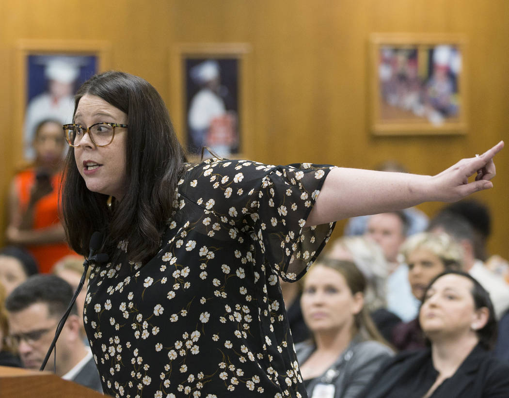 Alexis Salt, a parent and teacher at Leavitt Middle School, gets emotional while addressing the ...