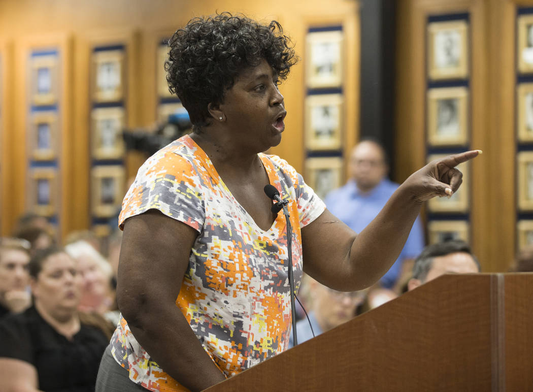 Suynn Davis, who's grandson attends Arbor View High School, addresses the Clark County School D ...