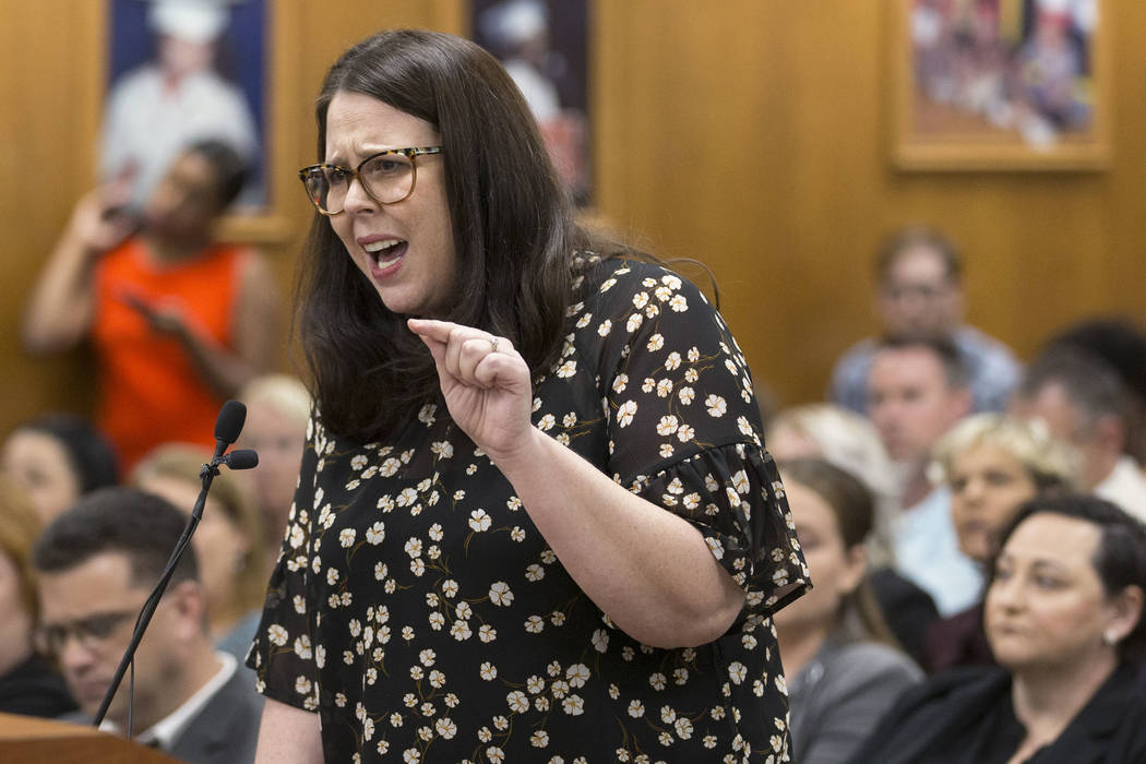 Alexis Salt, a parent and teacher at Leavitt Middle School, gets emotional while addressing the ...