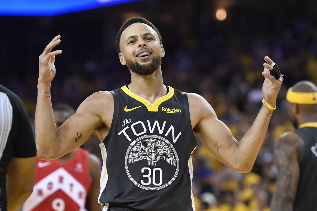 Golden State Warriors guard Stephen Curry reacts after teammate Klay Thompson was injured durin ...