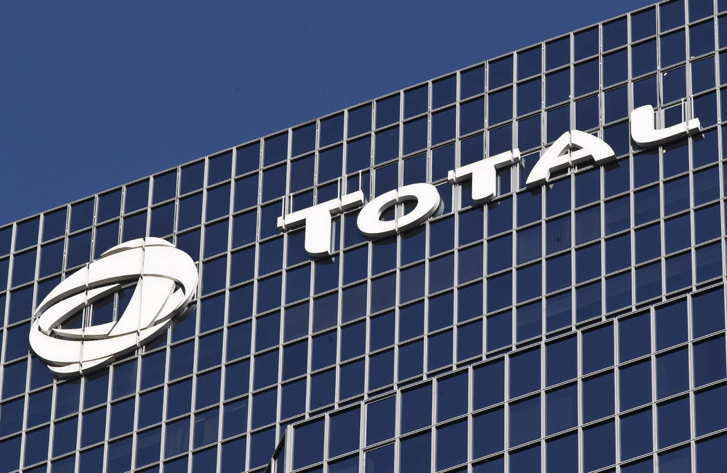 FILE - In this Jan.11, 2016 file photo, the logo of French oil giant Total SA is pictured at it ...