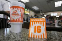A Whataburger tent order number sits on a table in Dallas, Wednesday, Aug. 9, 2017. (AP Photo/L ...