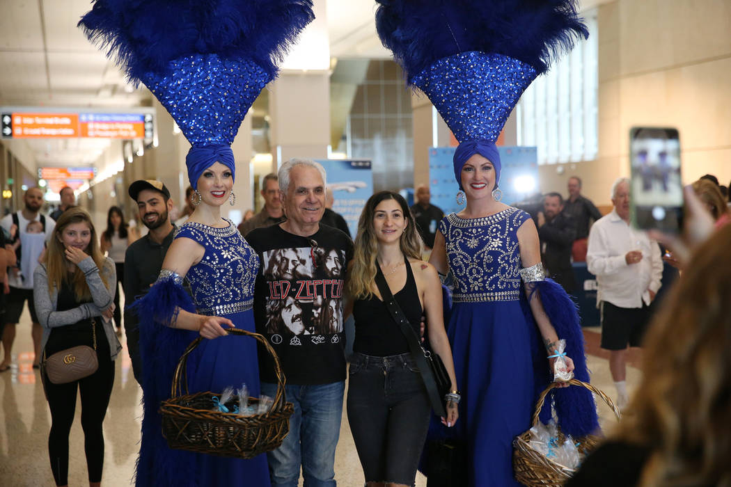 Yaron Yosef, second from left, with his daughter Nataly, take a photo with showgirls Jennifer A ...