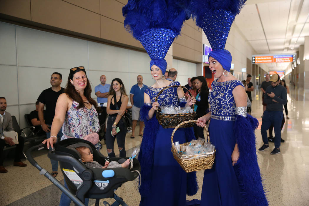 Tamar Menashe, from left, with her 3-month-old son Refael, interact with the showgirls Jennifer ...