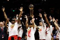 Toronto Raptors center Serge Ibaka, left, guard Kyle Lowry, center, and guard Danny Green, thir ...