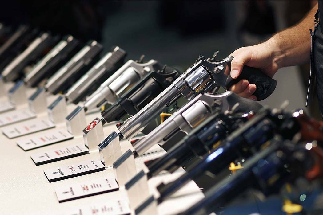 In this Jan. 19, 2016 file photo, handguns are displayed at the Smith & Wesson booth at the Sho ...