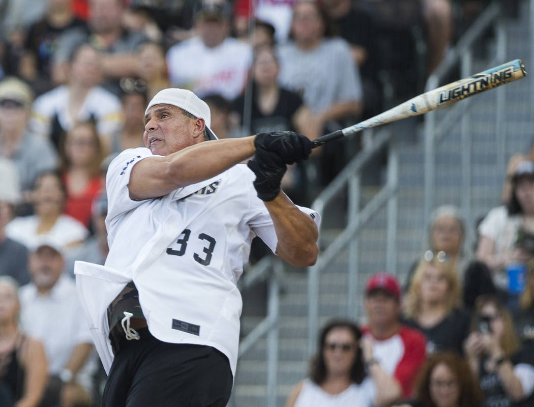Former Major League Baseball player Jose Canseco takes a swing during the  Battle For Vegas Char …