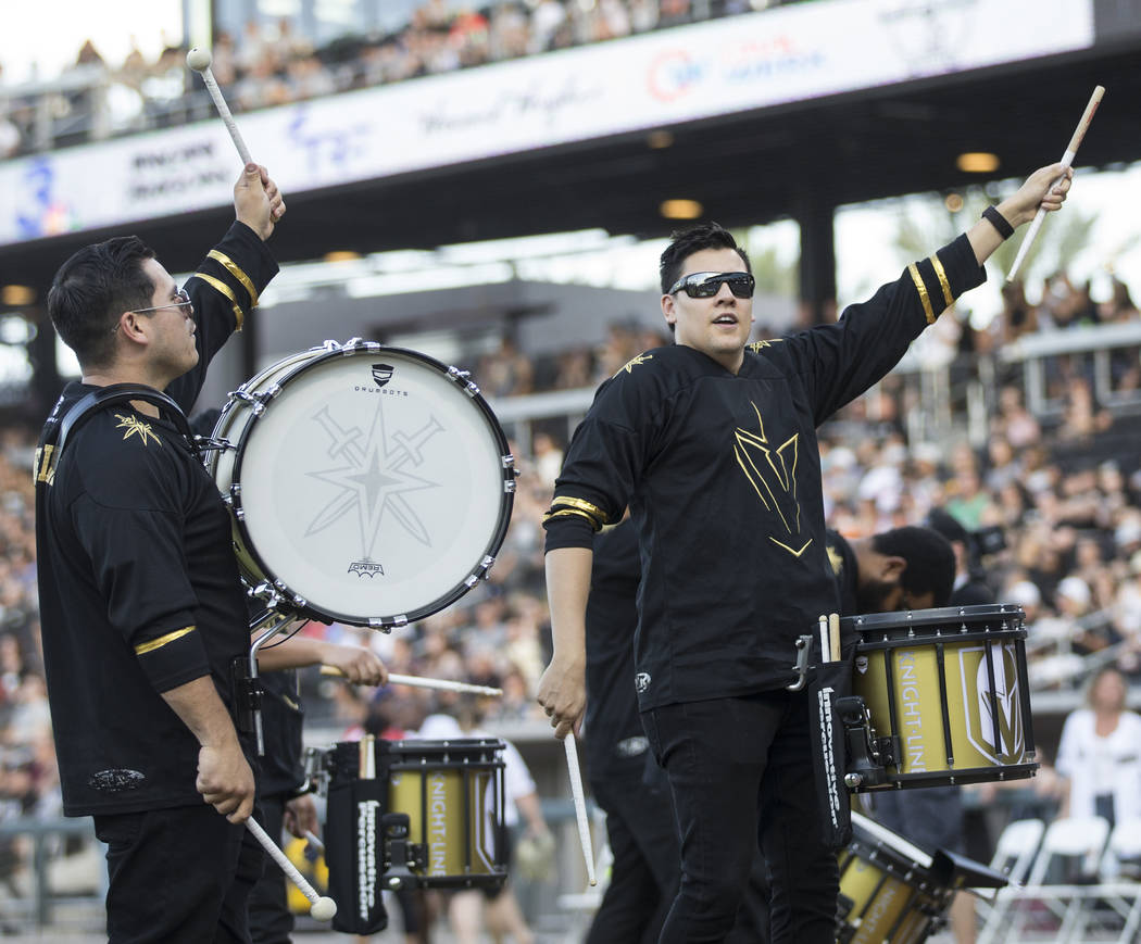The Golden Knights Knight Line drummers perform before the start of the Battle For Vegas Charit ...