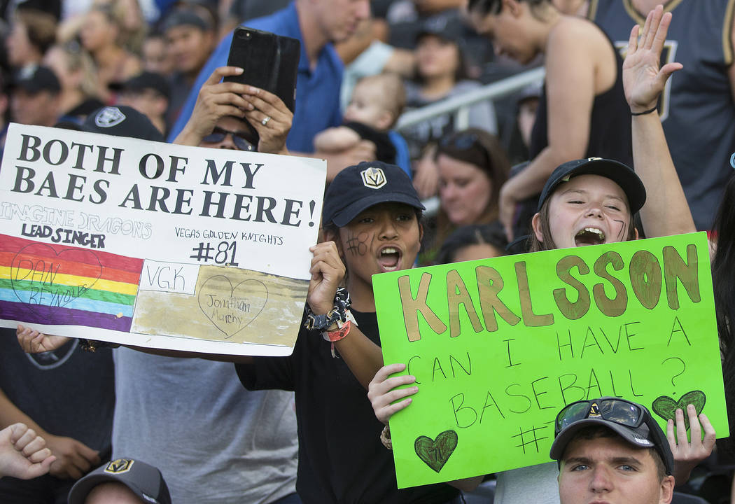 Ciarra Soto, right, and Teagan Barker cheer during the Battle For Vegas Charity Softball Game b ...