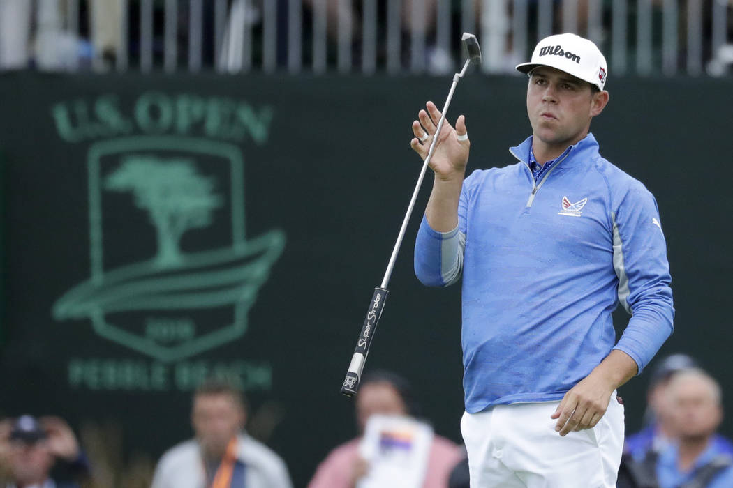 Gary Woodland reacts after missing a putt on the 18th hole during the third round of the U.S. O ...