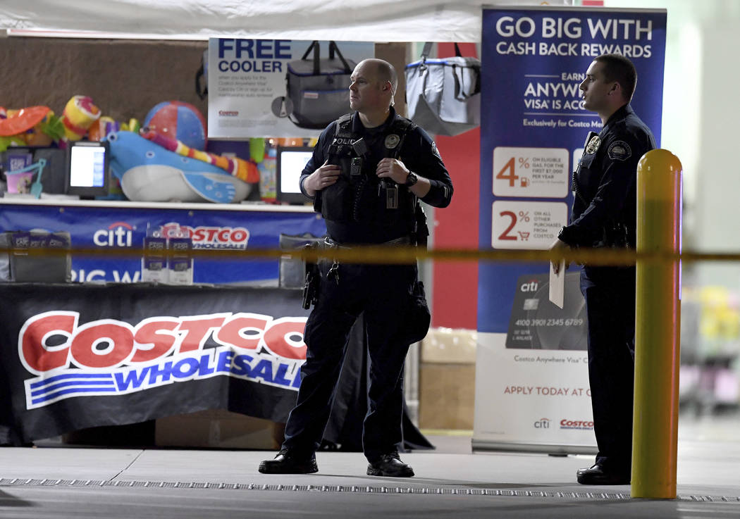 The Corona police department investigate a shooting inside a Costco in Corona, Calif., Friday, ...