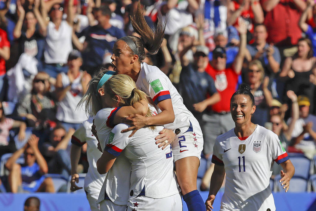 US players celebrate after teammate Julie Ertz scored their side's second goal during the Women ...