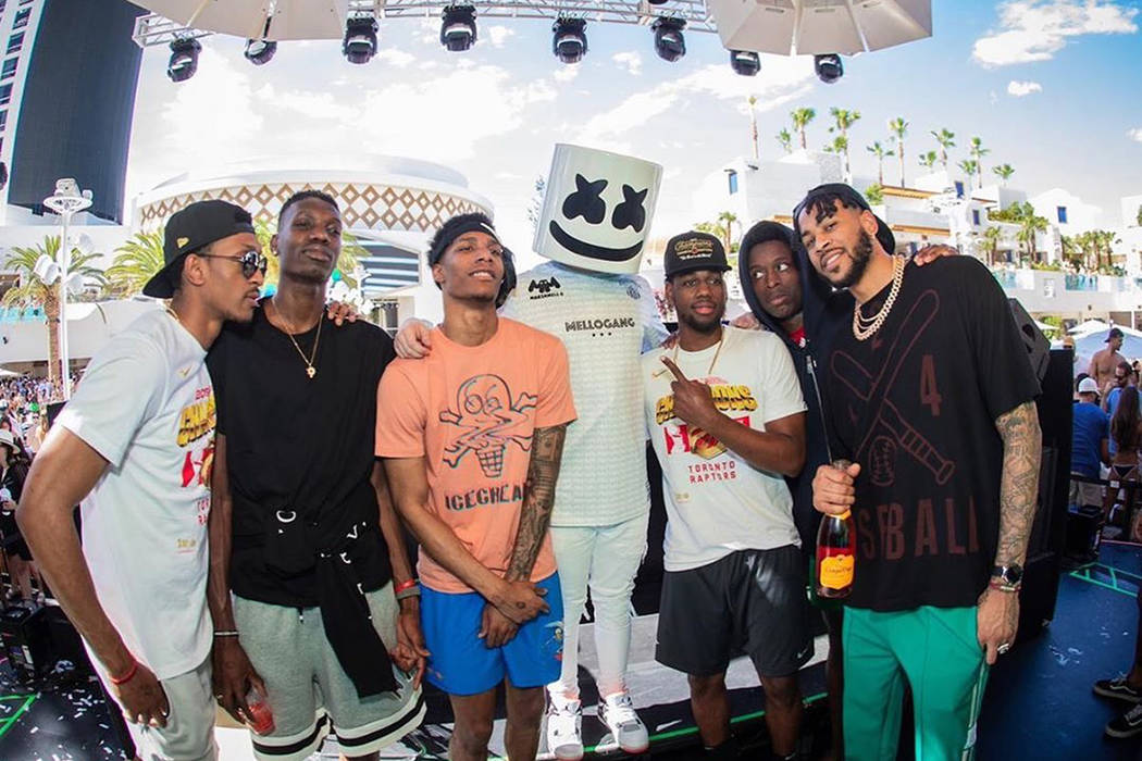 Star DJ Marshmello is shown with members of the NBA Champion Toronto Raptors at Kaos Dayclub on ...