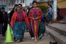 Indigenous women arrive at a polling station in Sumpango, Guatemala, Sunday, June 16, 2019. Gua ...
