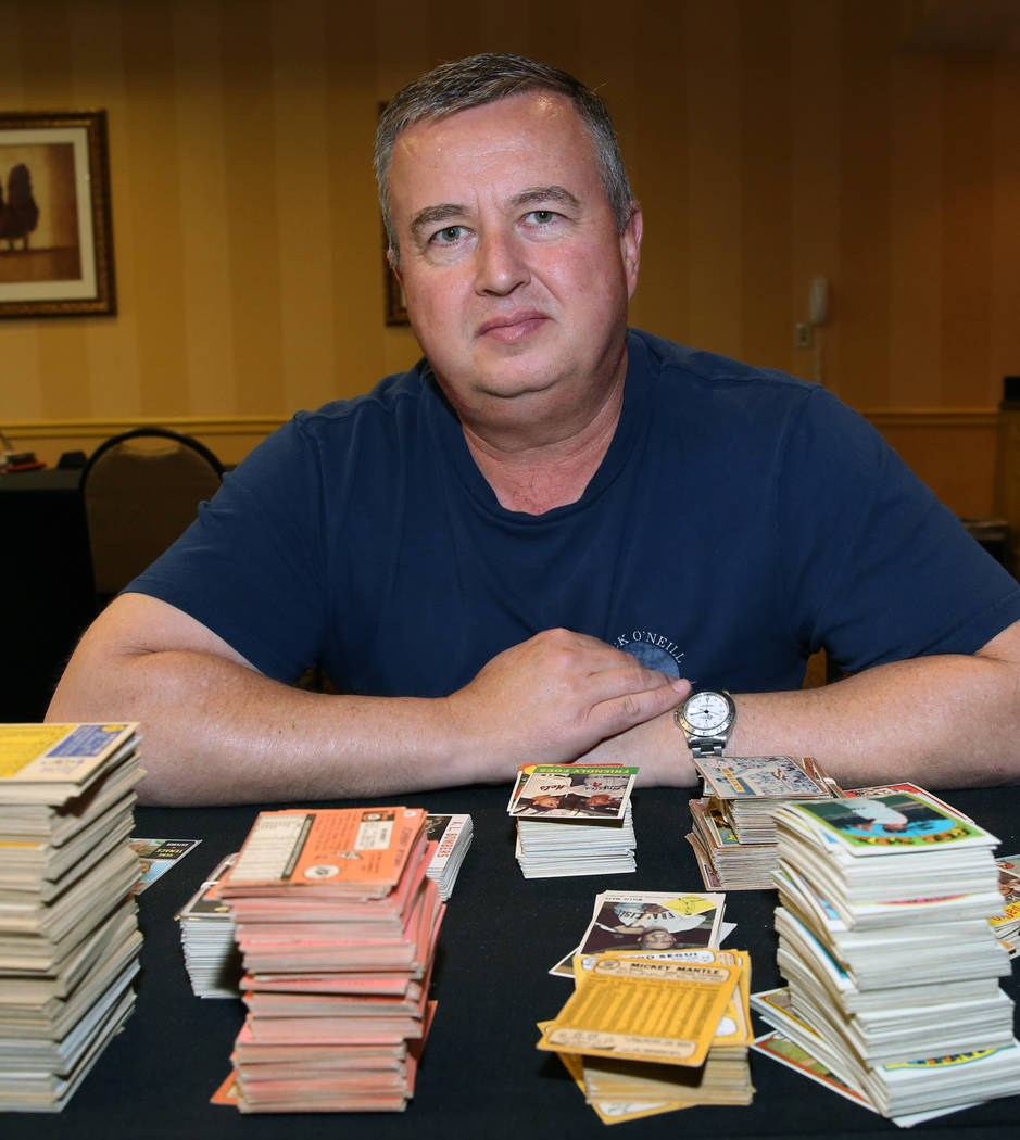 Brian Marcy, owner of Scottsdale Baseball Cards, shows off valuable sports cards he bought on F ...